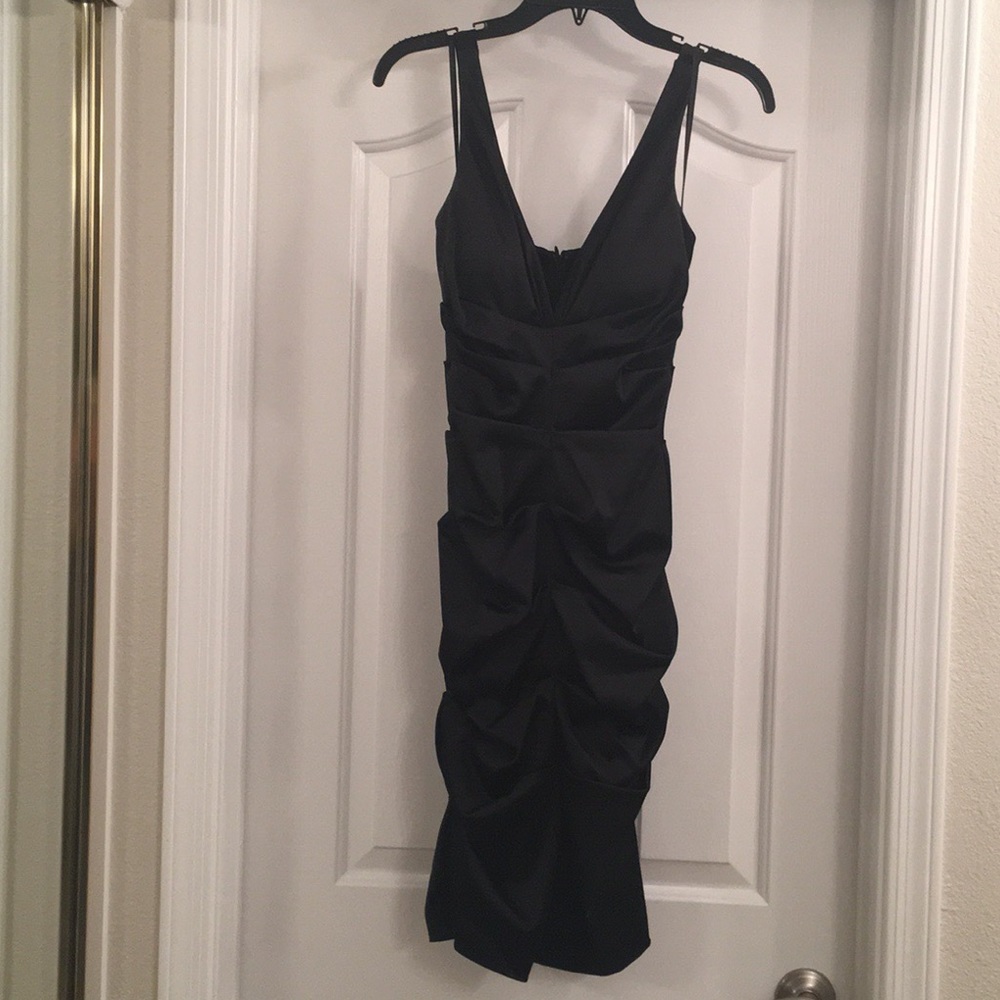Black fitted midi length dress Size 4 by Xscape.